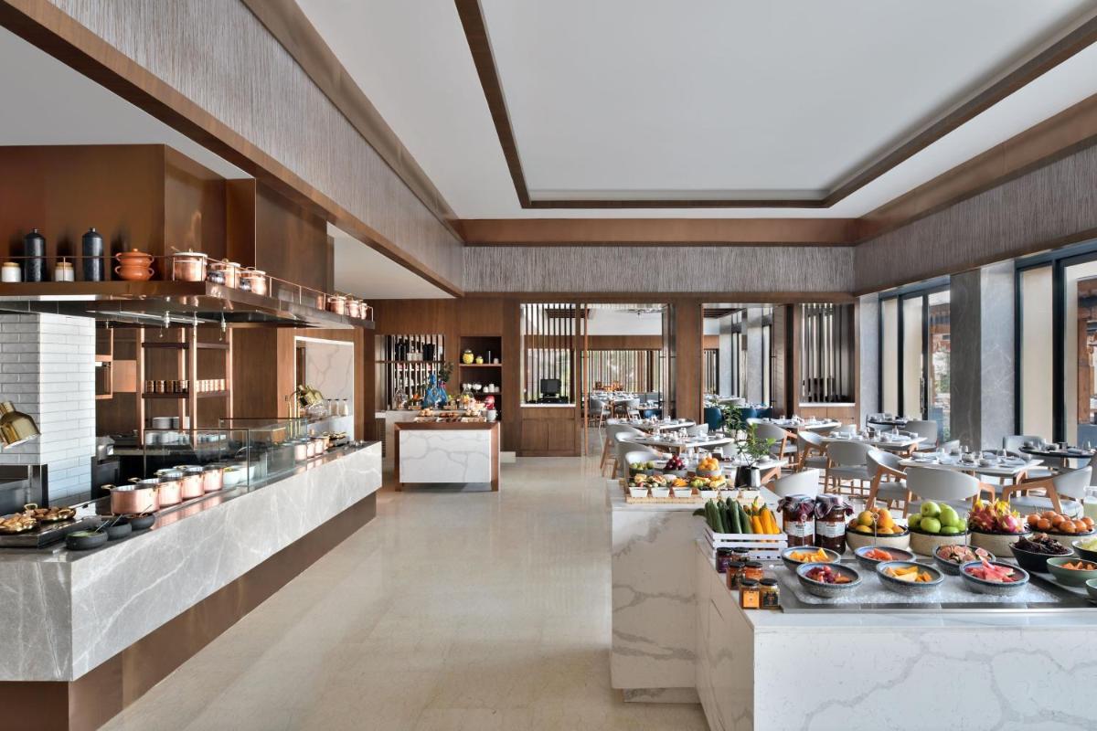 a restaurant with a lot of food on display at The Westin Resort & Spa Himalayas in Rishīkesh