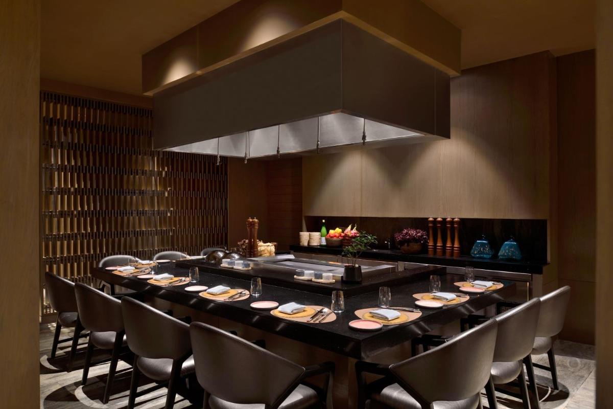 a large dining room with a long table and chairs at The Westin Resort & Spa Himalayas in Rishīkesh