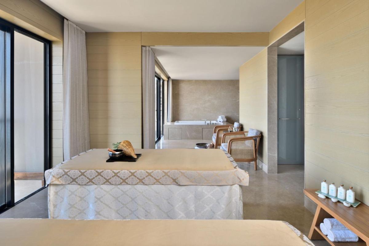 a hotel room with a bed and a bedroom at The Westin Resort & Spa Himalayas in Rishīkesh