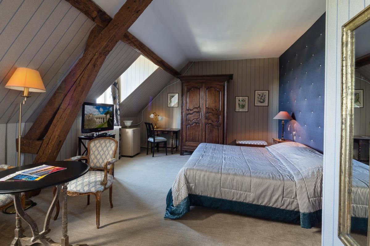 Un ou plusieurs lits dans un hébergement de l'établissement Chateau De Fere