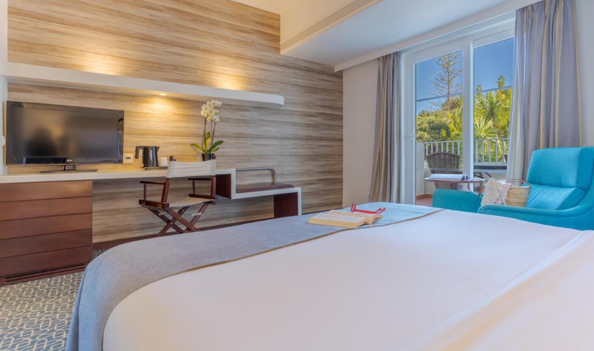Uma cama ou camas num quarto em Pestana Alvor Praia Premium Beach & Golf Resort