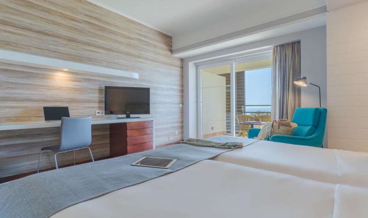 Uma cama ou camas num quarto em Pestana Alvor Praia Premium Beach & Golf Resort