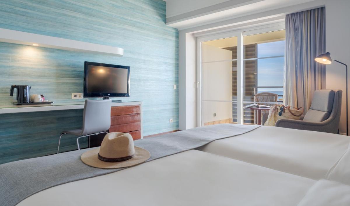 Uma cama ou camas num quarto em Pestana Alvor Praia Premium Beach & Golf Resort
