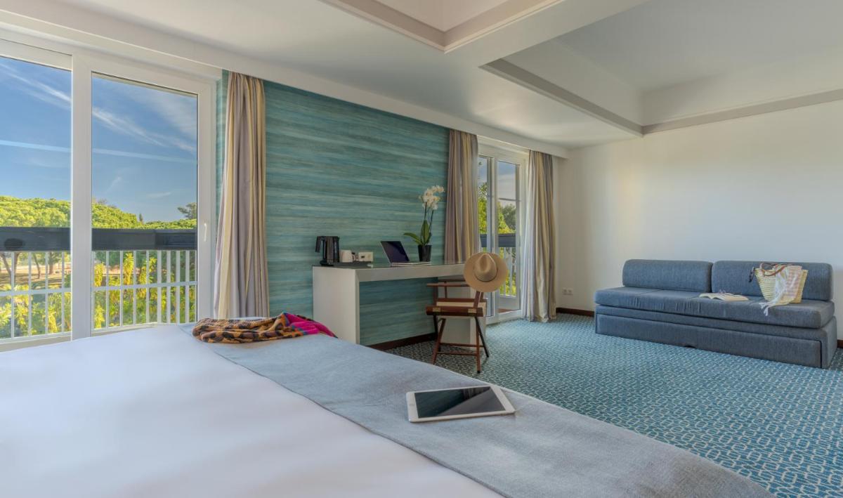 Uma cama ou camas num quarto em Pestana Alvor Praia Premium Beach & Golf Resort