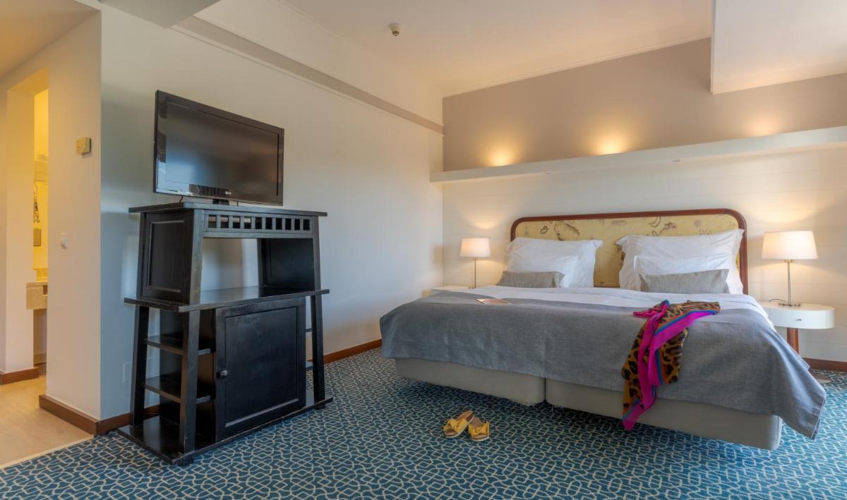 Uma cama ou camas num quarto em Pestana Alvor Praia Premium Beach & Golf Resort