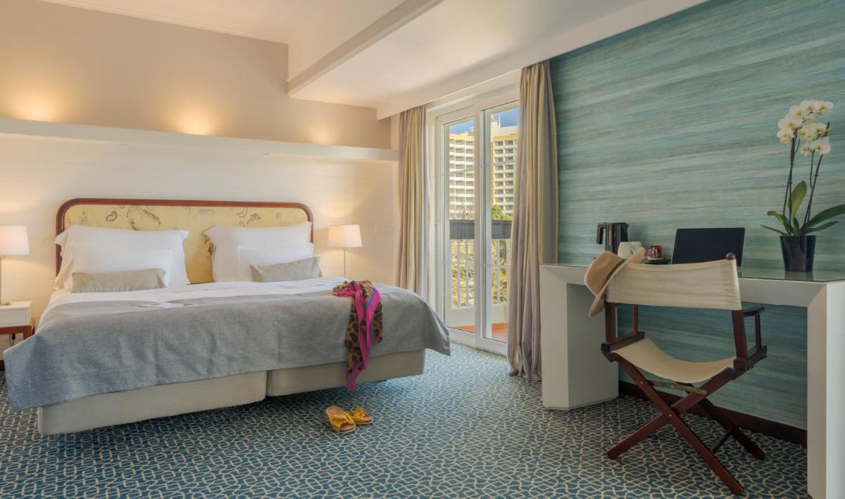 Uma cama ou camas num quarto em Pestana Alvor Praia Premium Beach & Golf Resort