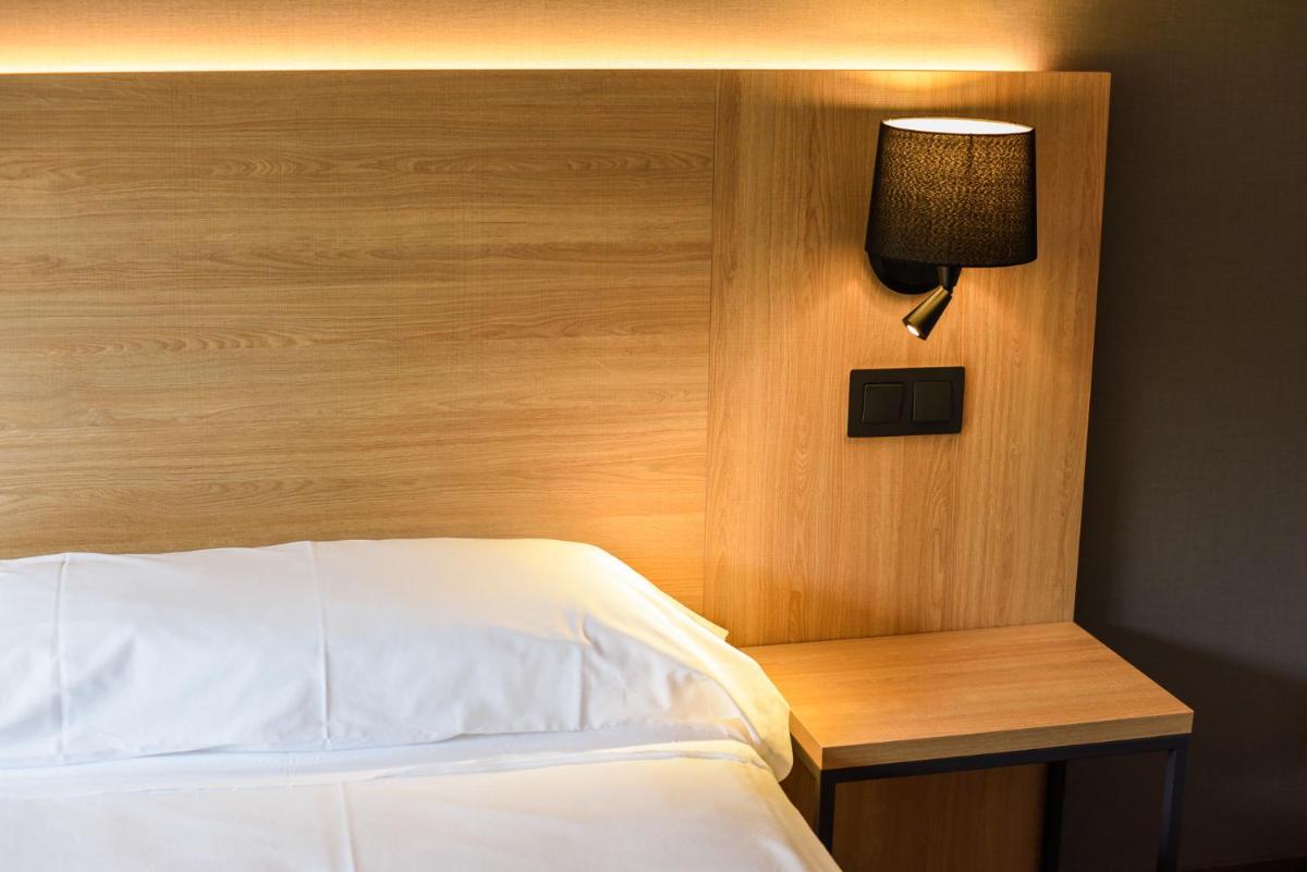 Cama o camas de una habitación en SOMMOS Hotel Benasque Spa