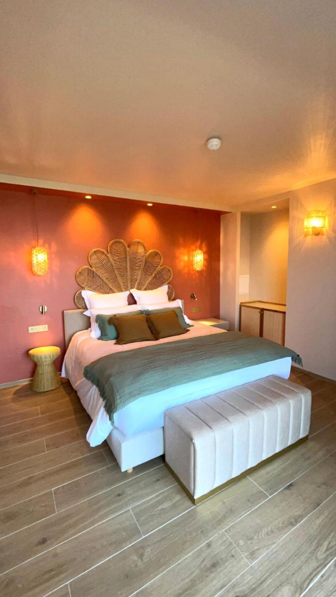 Un ou plusieurs lits dans un hébergement de l'établissement Hotel Riva Beach