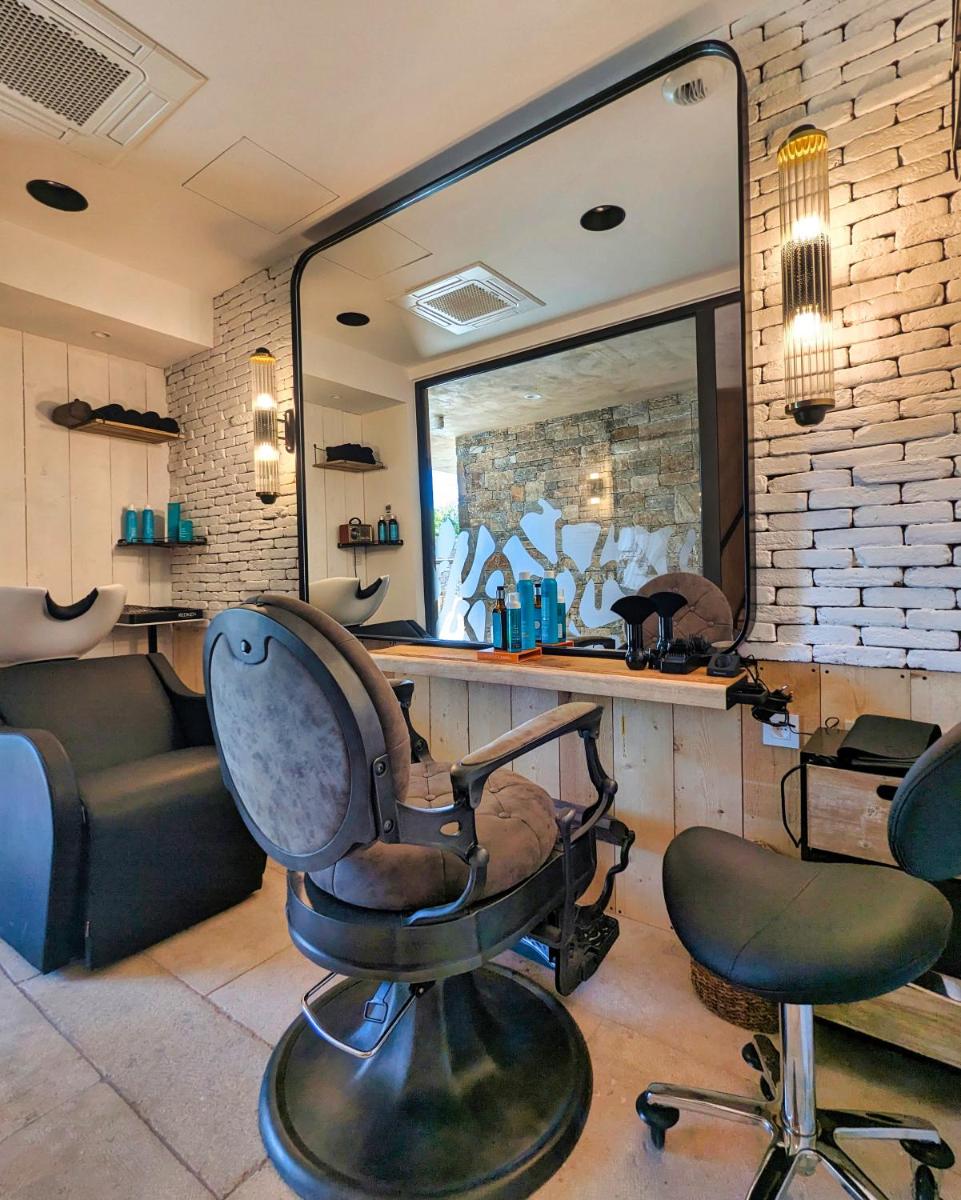 Coin salon dans l'établissement Les Regalia Hôtel & Spa