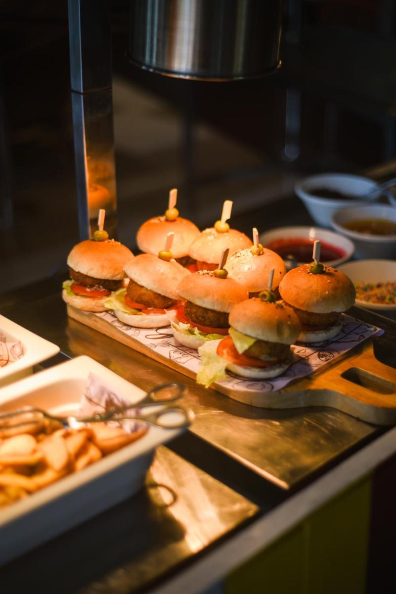 a group of sandwiches sitting on a counter in a kitchen at Holiday Inn New Delhi Aerocity by IHG in New Delhi