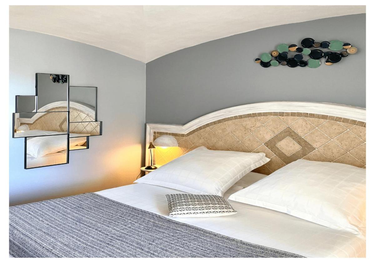 Un ou plusieurs lits dans un hébergement de l'établissement Ostella Spa & Resort