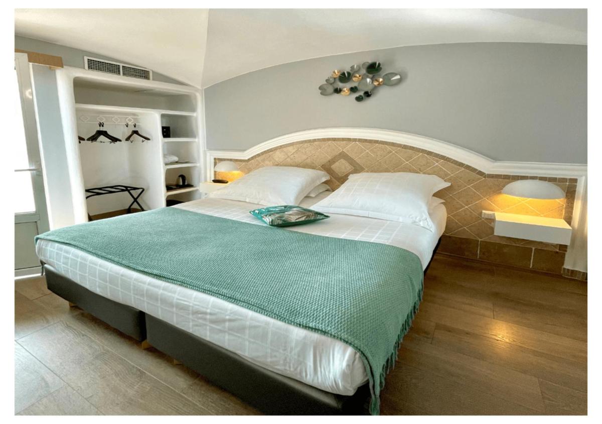 Un ou plusieurs lits dans un hébergement de l'établissement Ostella Spa & Resort