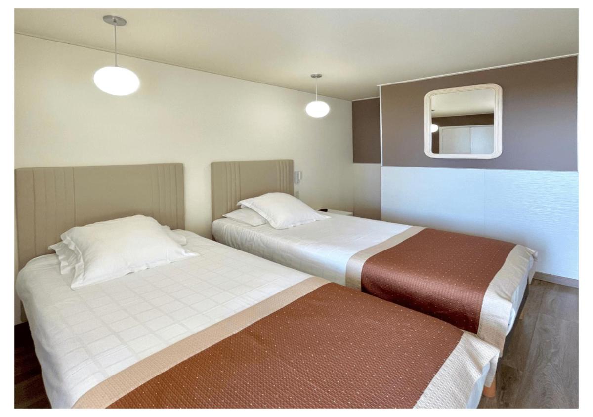 Un ou plusieurs lits dans un hébergement de l'établissement Ostella Spa & Resort