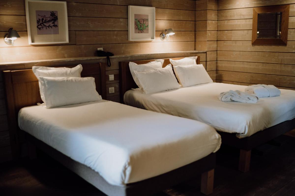 Un ou plusieurs lits dans un hébergement de l'établissement Emeria Dinard Thalasso Spa