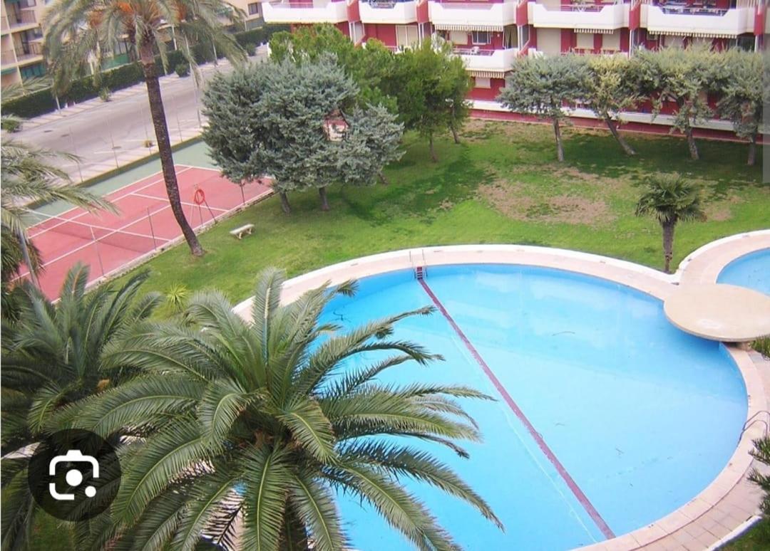 Acogedor apartamento en Daimús a 150 metros de la playa con parking privado y piscinas comunitarias - Housity