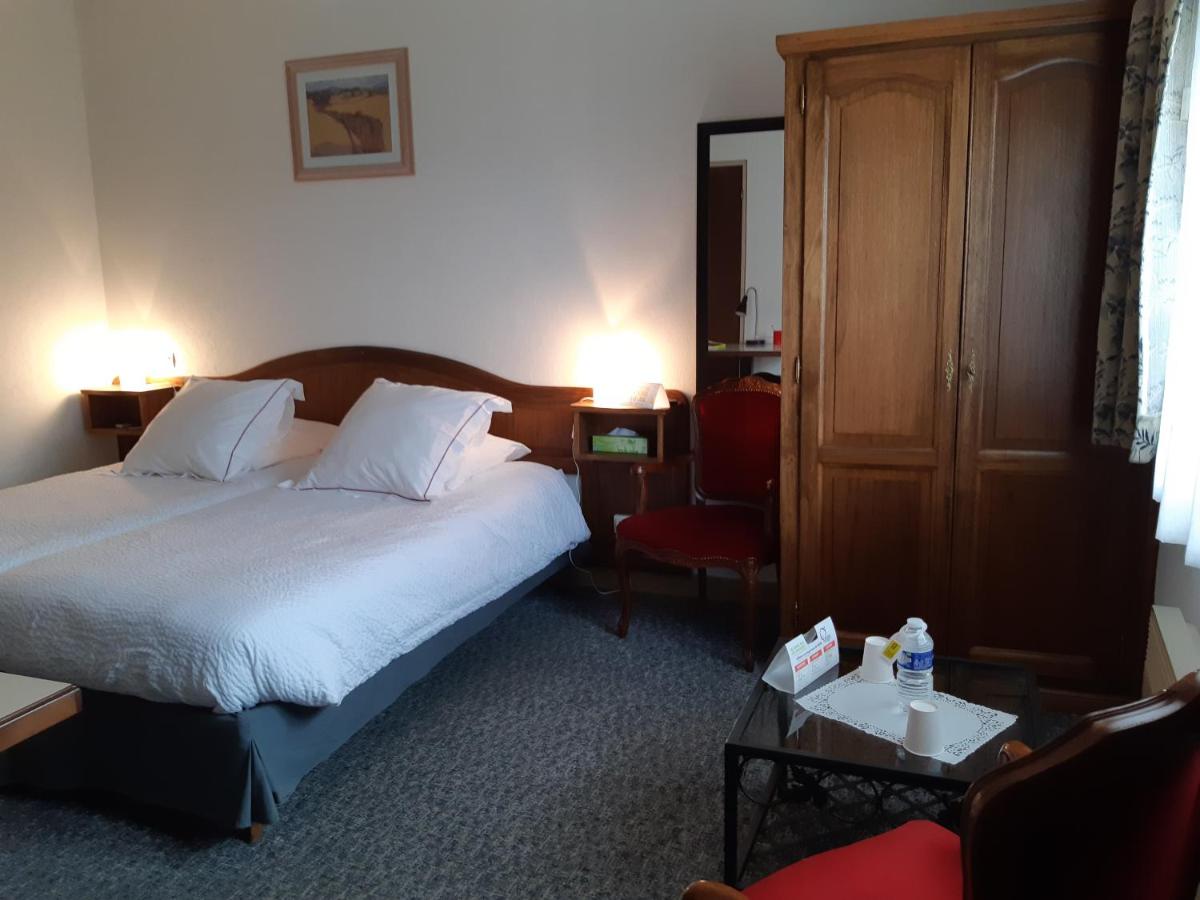 Un ou plusieurs lits dans un hébergement de l'établissement Hotel-Spa & Restaurant Logis Domaine Langmatt