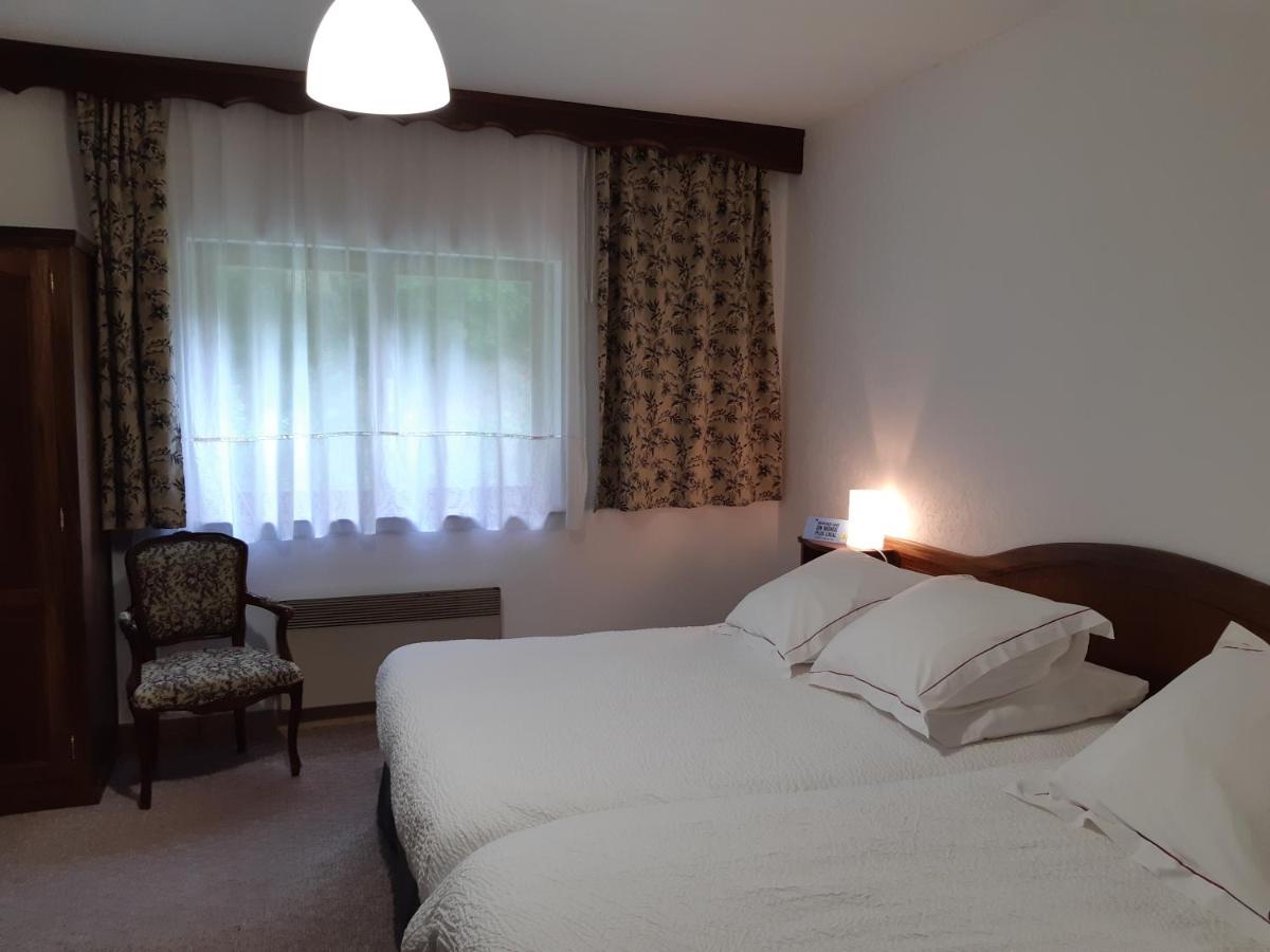 Un ou plusieurs lits dans un hébergement de l'établissement Hotel-Spa & Restaurant Logis Domaine Langmatt
