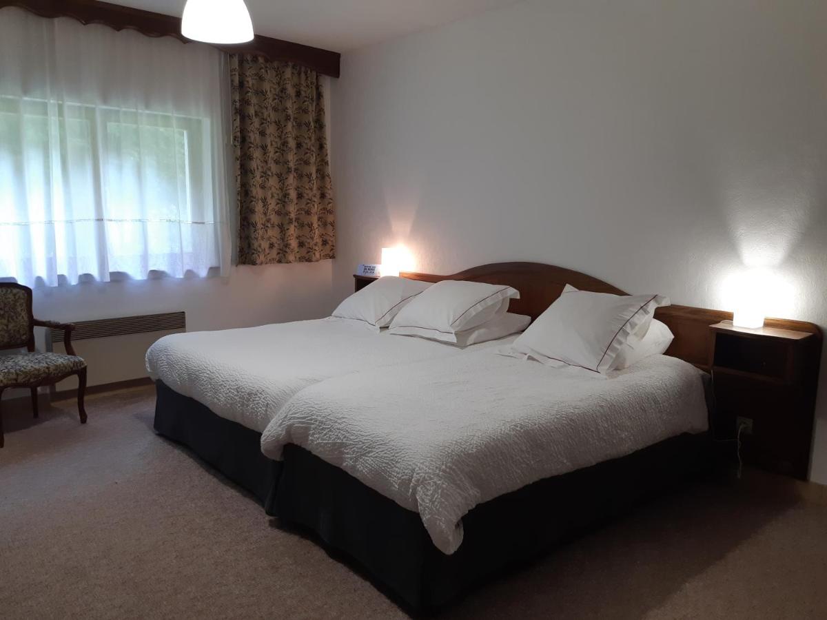 Un ou plusieurs lits dans un hébergement de l'établissement Hotel-Spa & Restaurant Logis Domaine Langmatt