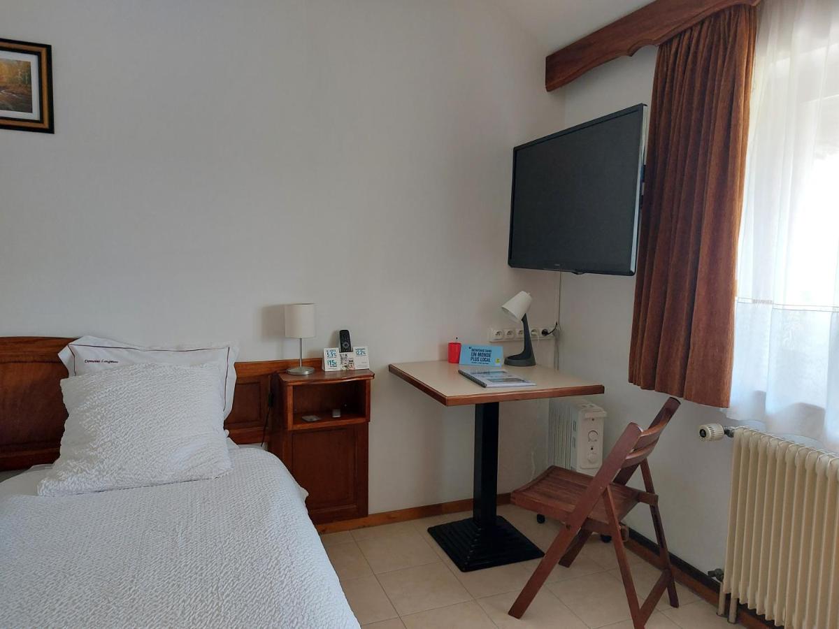 Un ou plusieurs lits dans un hébergement de l'établissement Hotel-Spa & Restaurant Logis Domaine Langmatt