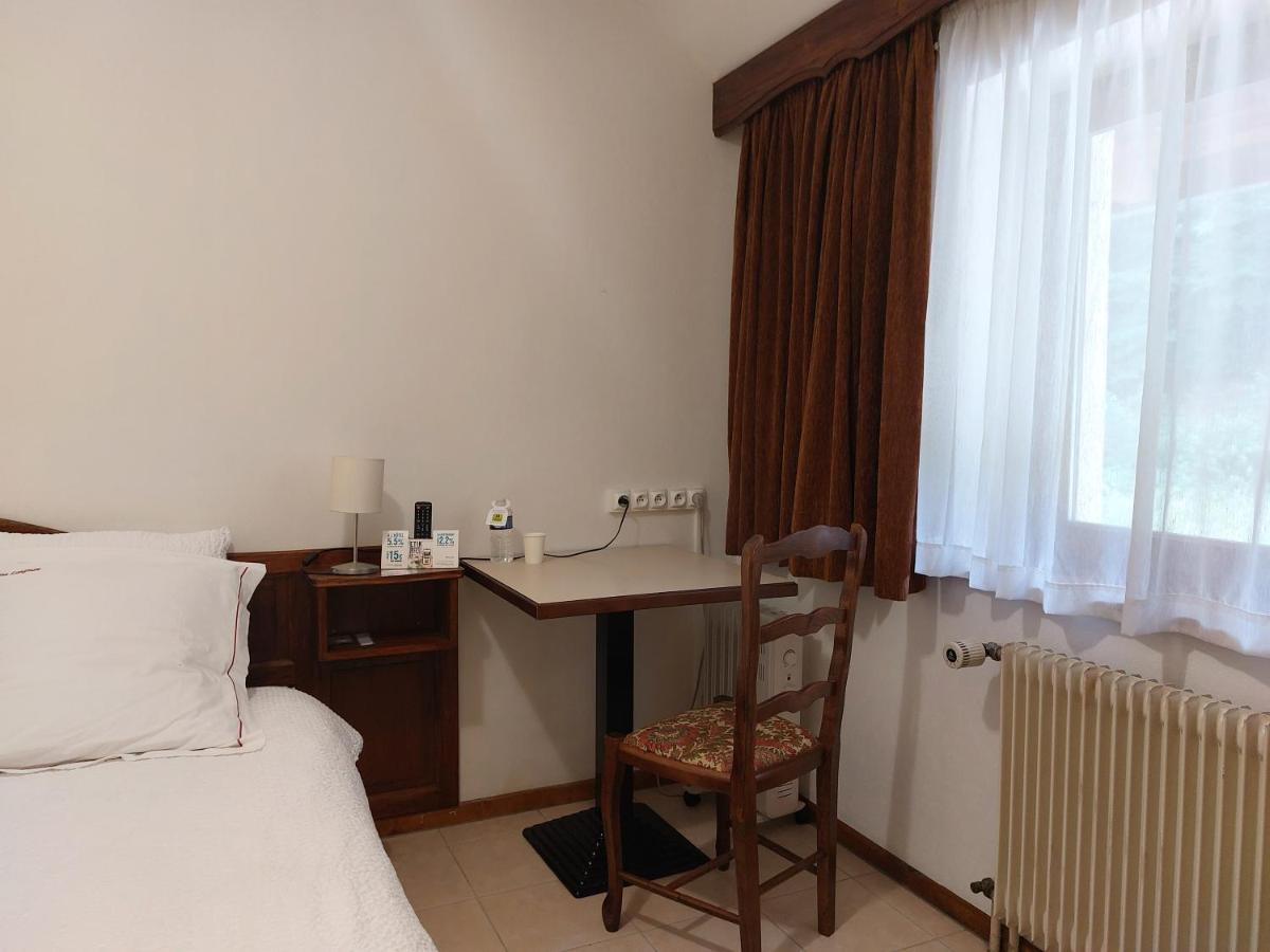 Un ou plusieurs lits dans un hébergement de l'établissement Hotel-Spa & Restaurant Logis Domaine Langmatt