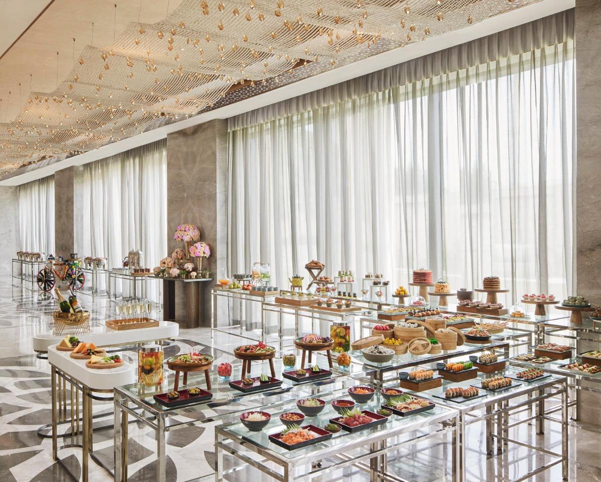 a buffet line with many food items on display at Taj Amer, Jaipur in Jaipur