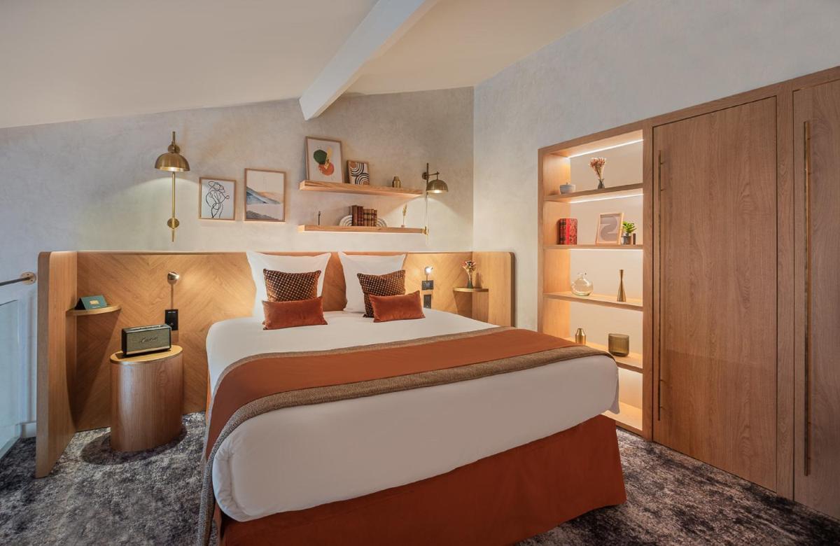 Un ou plusieurs lits dans un hébergement de l'établissement Hôtel Burdigala by Inwood Hotels