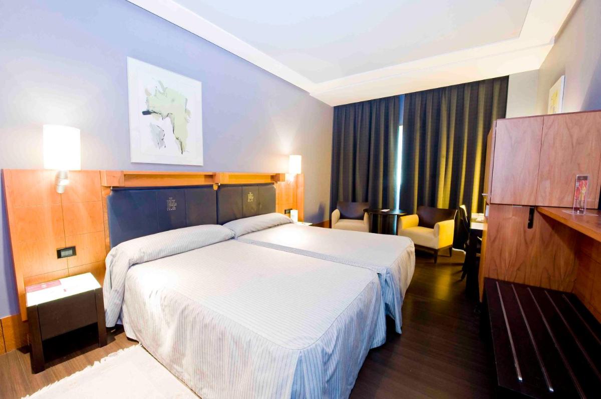 Cama o camas de una habitación en Gran Hotel Lakua