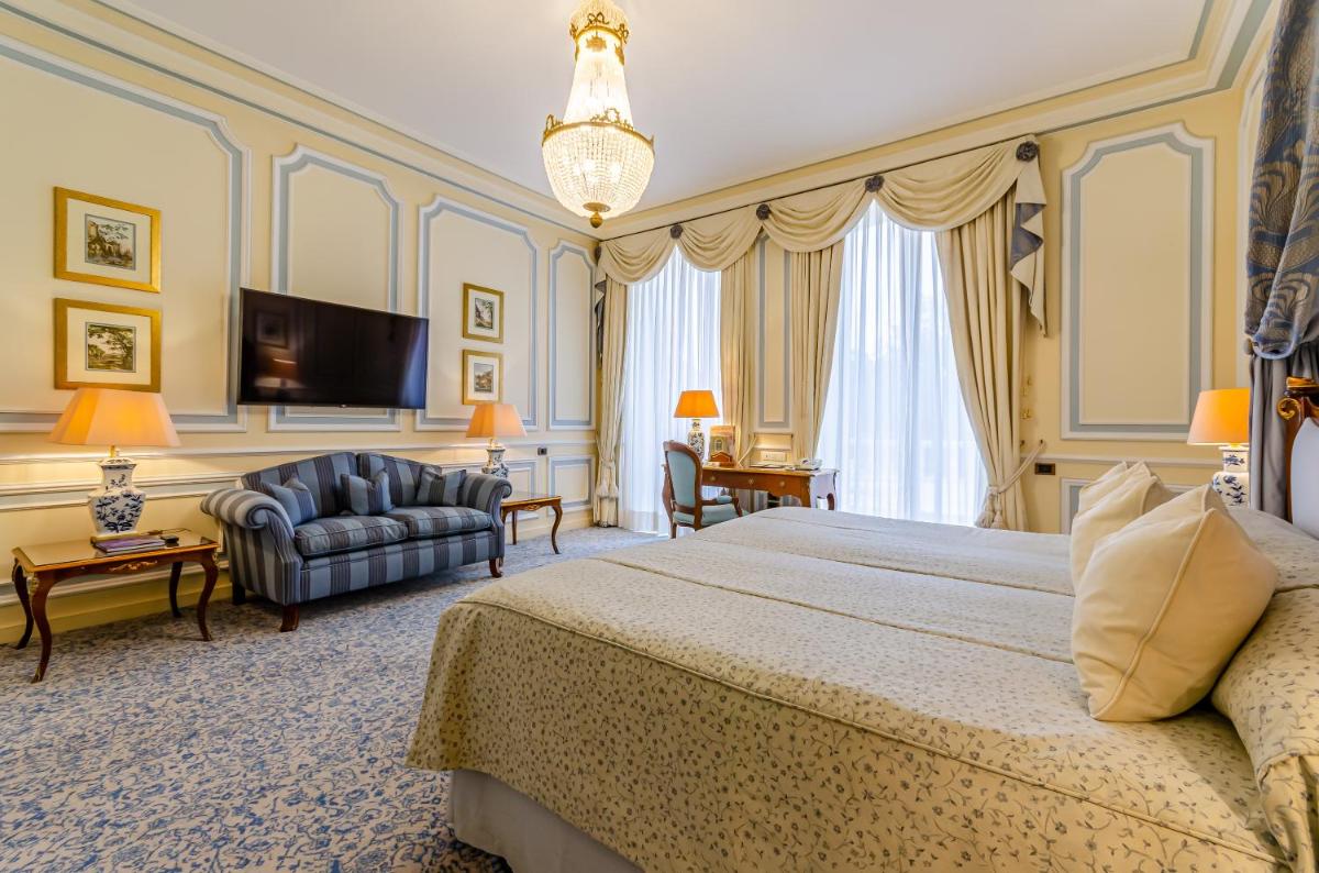Uma cama ou camas num quarto em Olissippo Lapa Palace – The Leading Hotels of the World