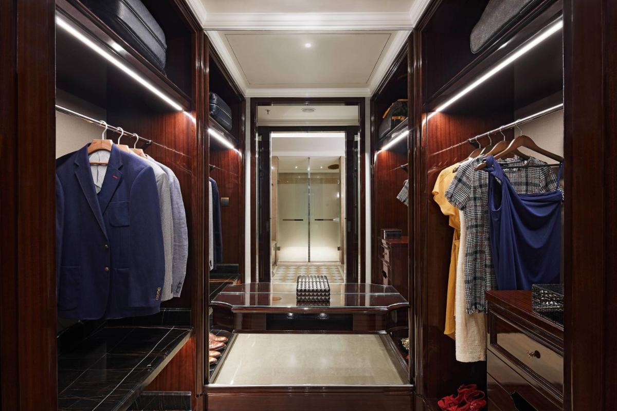 a dressing room with a walk in closet at The Ritz-Carlton, Pune in Pune