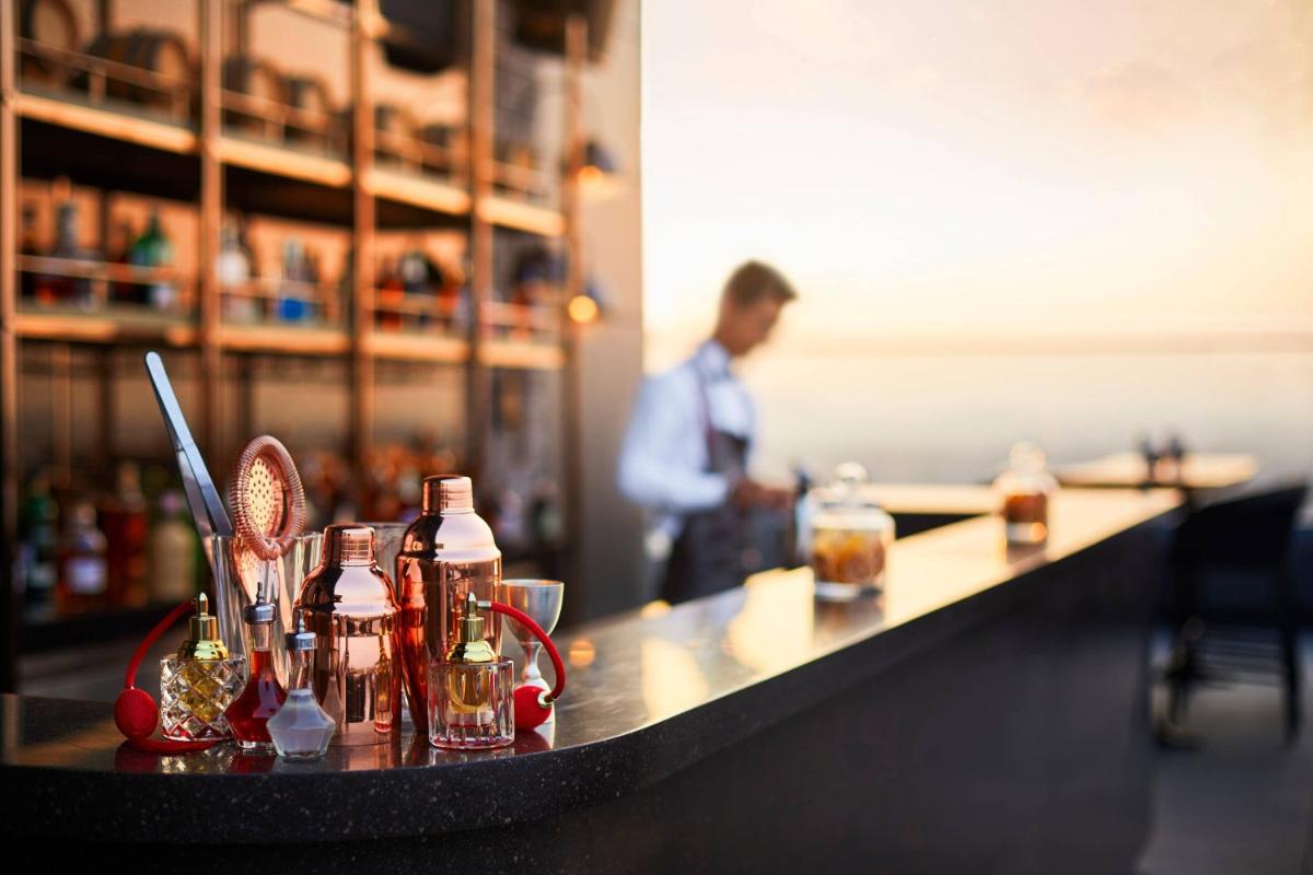 a bar with bottles of alcohol on a counter at The Ritz-Carlton, Pune in Pune