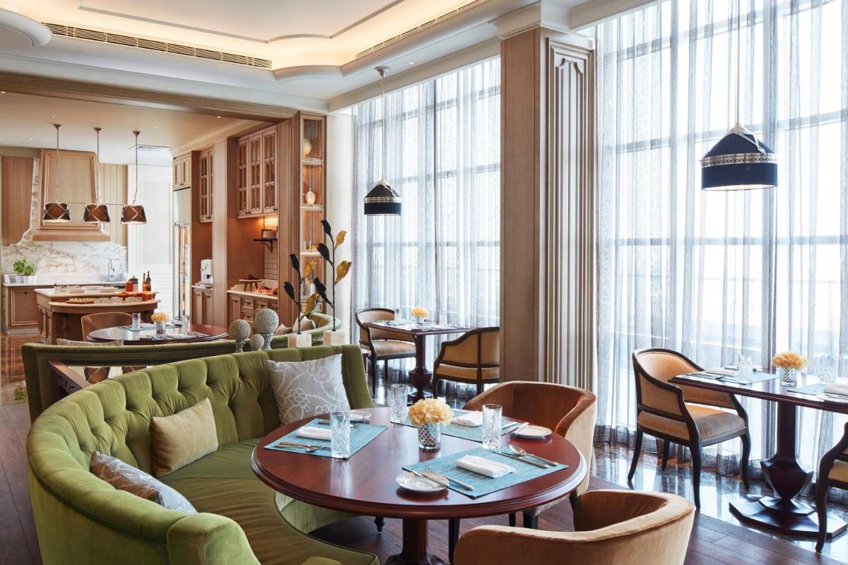 a living room with a couch and a table at The Ritz-Carlton, Pune in Pune