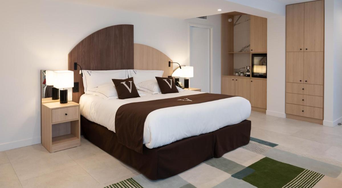 Un ou plusieurs lits dans un hébergement de l'établissement Le Vallon de Valrugues Hotel Spa & Villas