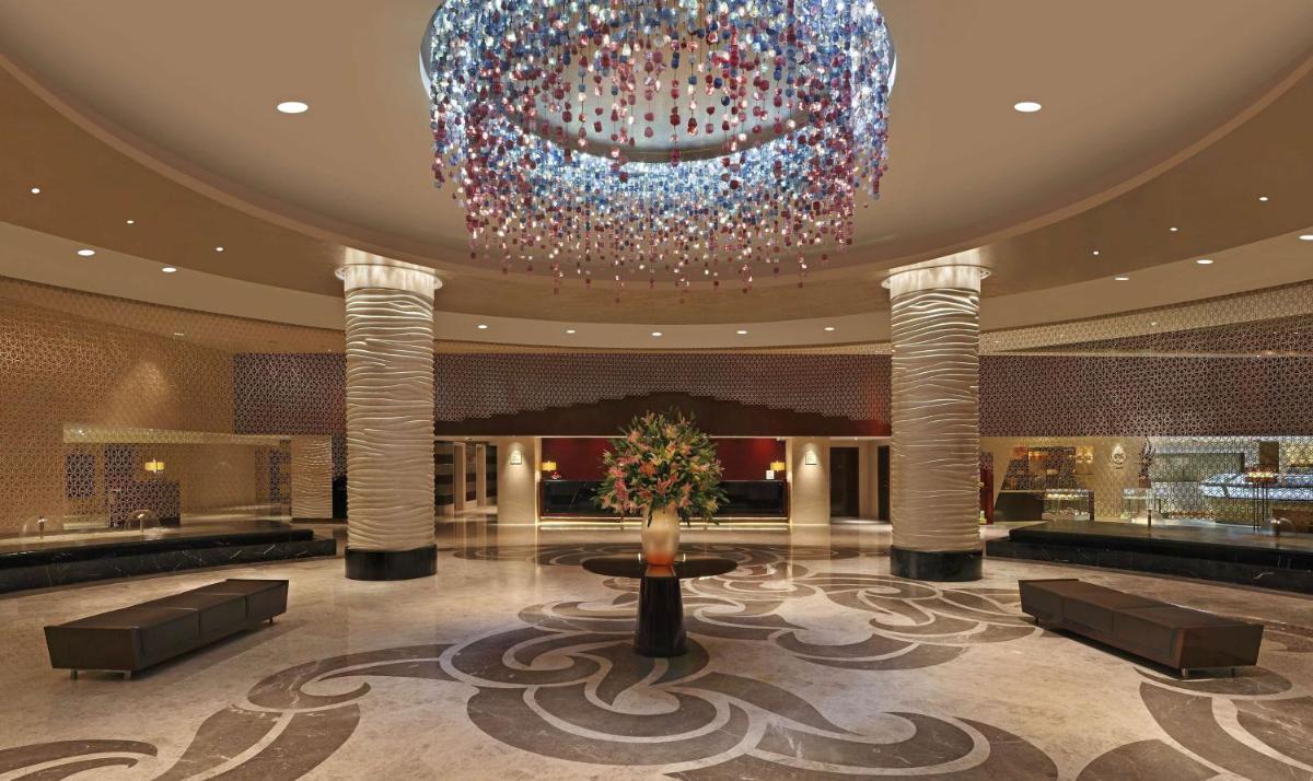 a large chandelier in the lobby of a hotel at Hilton Chennai in Chennai