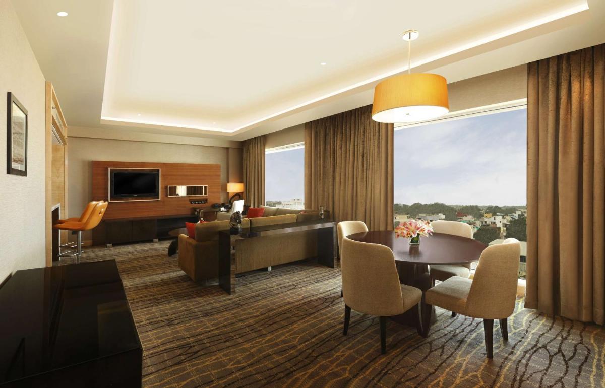 a living room with a couch and a table at Hilton Chennai in Chennai