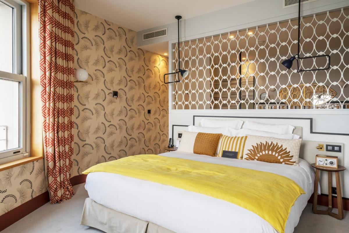 Un ou plusieurs lits dans un hébergement de l'établissement Castelbrac Hotel & Spa