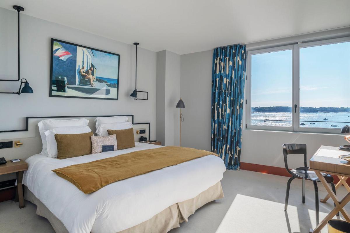 Un ou plusieurs lits dans un hébergement de l'établissement Castelbrac Hotel & Spa