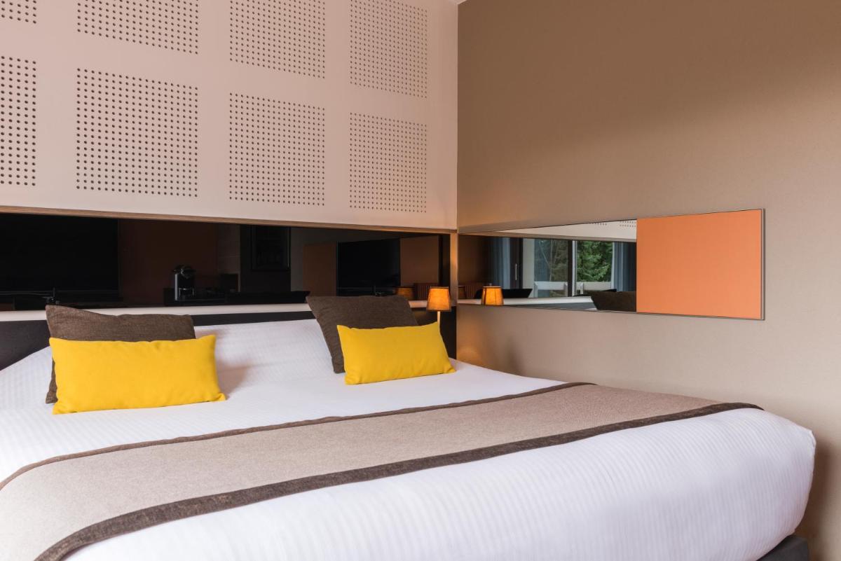 Un ou plusieurs lits dans un hébergement de l'établissement Hôtel Diana Restaurant & Spa by HappyCulture