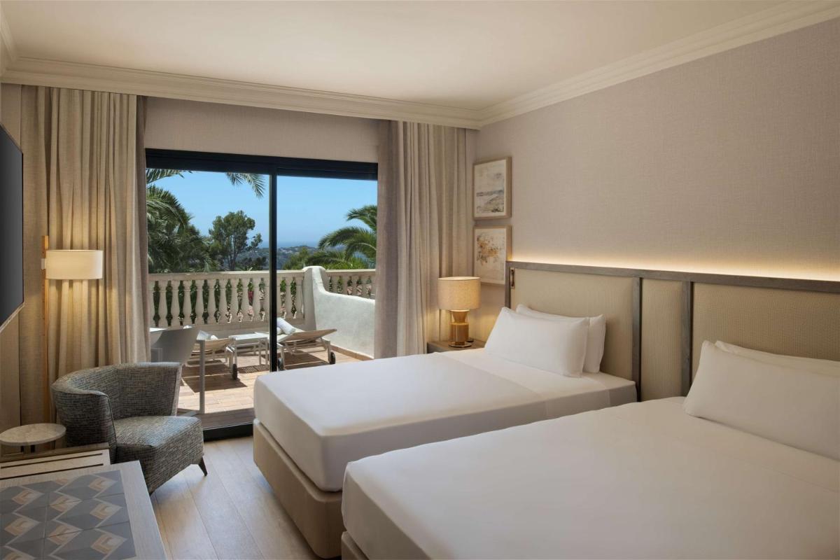 Cama o camas de una habitación en Hilton Mallorca Galatzo