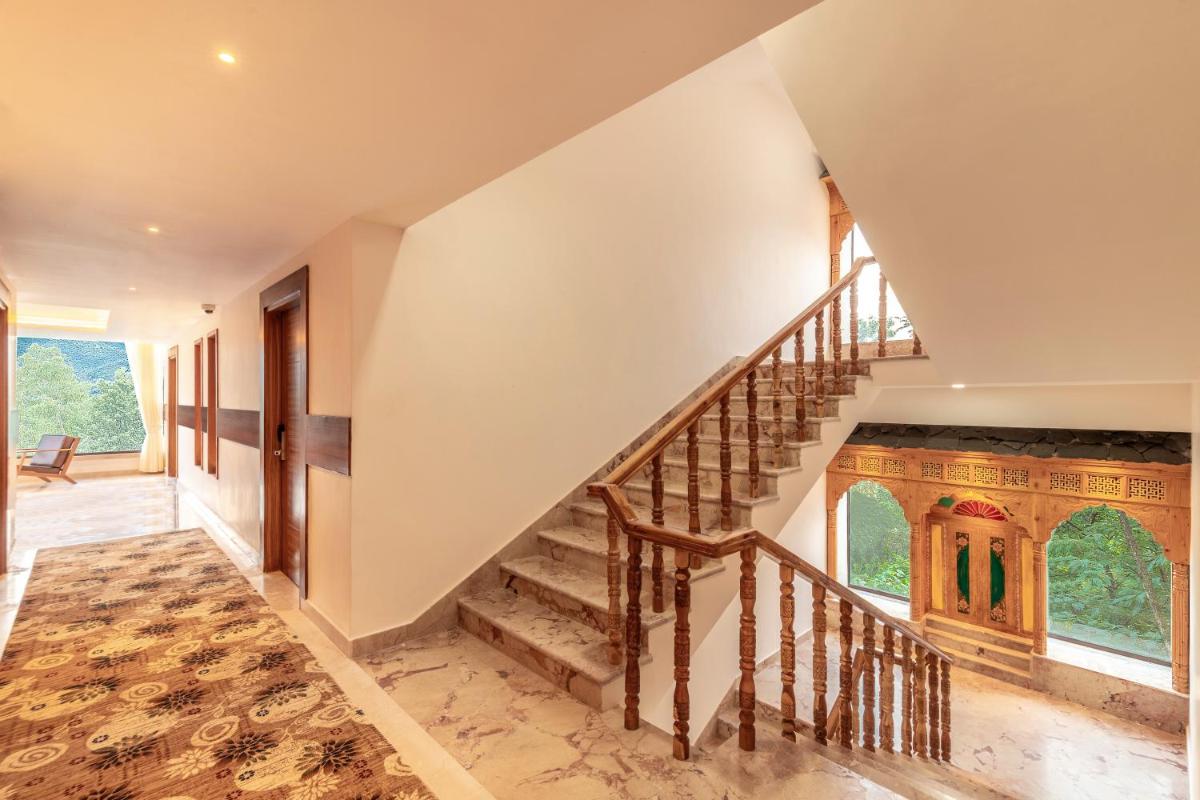 an image of a staircase in a house at The Prominence Mussoorie Road Dehradun in Dehradun