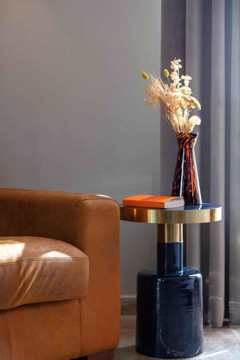 Coin salon dans l'établissement Hôtel La Dimora & Spa