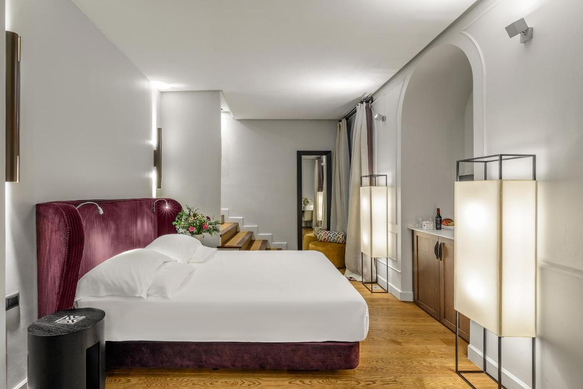 Cama o camas de una habitación en CoolRooms Palacio Villapanés 5 GL