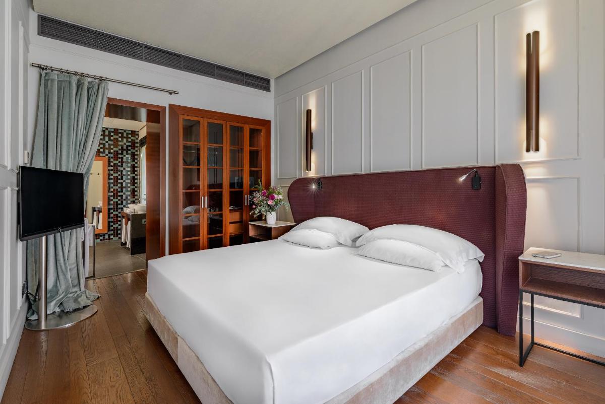 Cama o camas de una habitación en CoolRooms Palacio Villapanés 5 GL