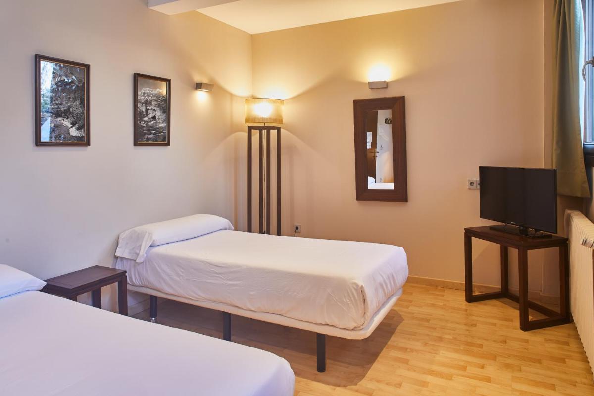 Cama o camas de una habitación en Silken Ordesa
