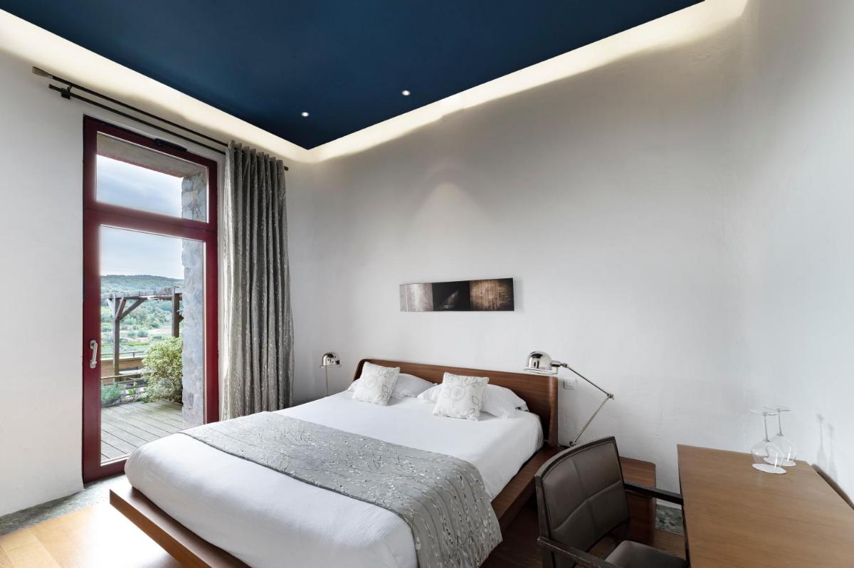 Un ou plusieurs lits dans un hébergement de l'établissement Domaine Riberach - Hotel 4 - Restaurant gastronomique - Spa - Piscine - Vignoble