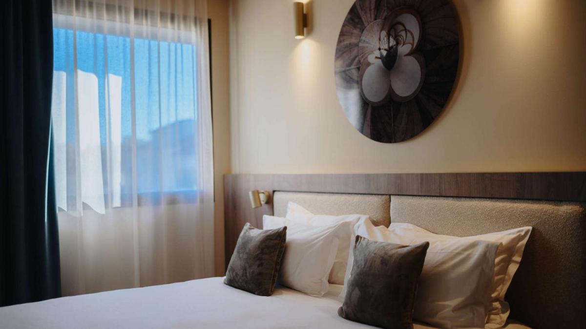 Un ou plusieurs lits dans un hébergement de l'établissement Keystone Hôtel & Spa