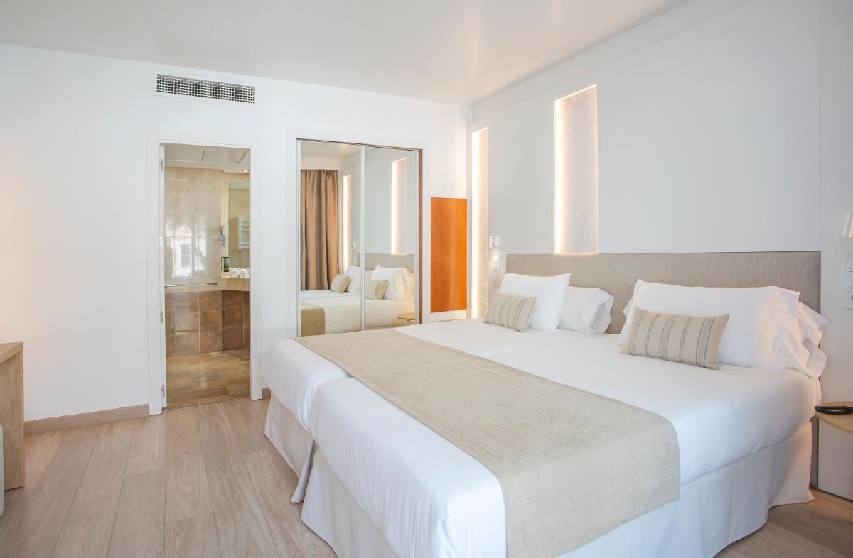 Cama o camas de una habitación en Marins Playa