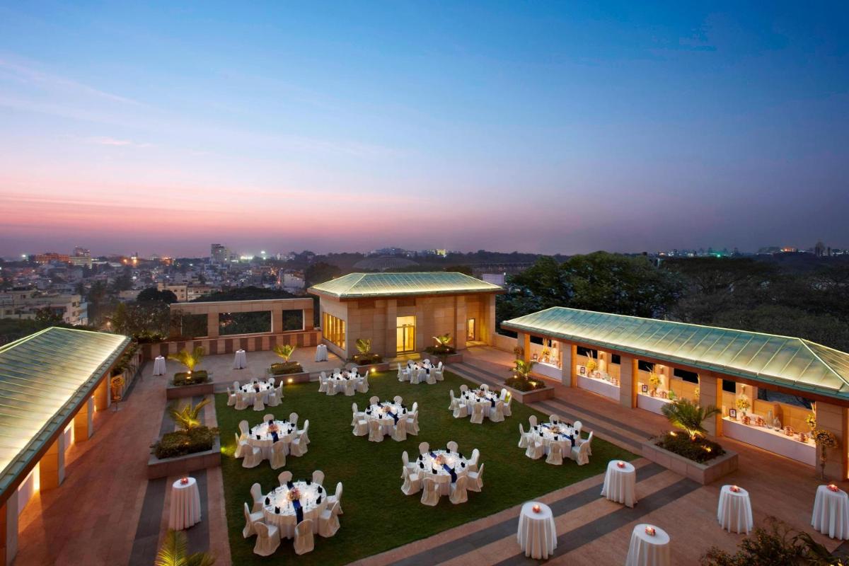 an overhead view of a building with tables and chairs at ITC Gardenia, a Luxury Collection Hotel, Bengaluru in Bengaluru an overhead view of a building with tables and chairs at ITC Gardenia, a Luxury Collection Hotel, Bengaluru in Bengaluru