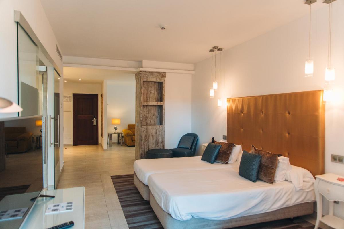 Cama o camas de una habitación en Lago Garden Apart-Suites & Spa Hotel