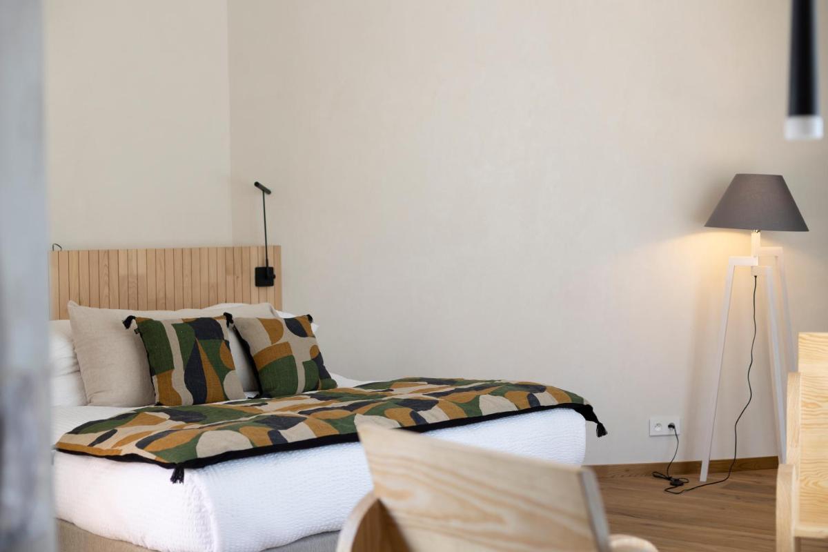Un ou plusieurs lits dans un hébergement de l'établissement A SPERANZA Suites avec piscine privative chauffée