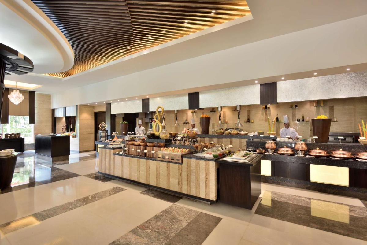 a rendering of the buffet in the lobby of a hotel at Radisson Blu Hotel, Indore in Indore